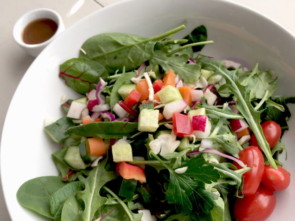 close up view of crunch confetti chopped salad in white bowl