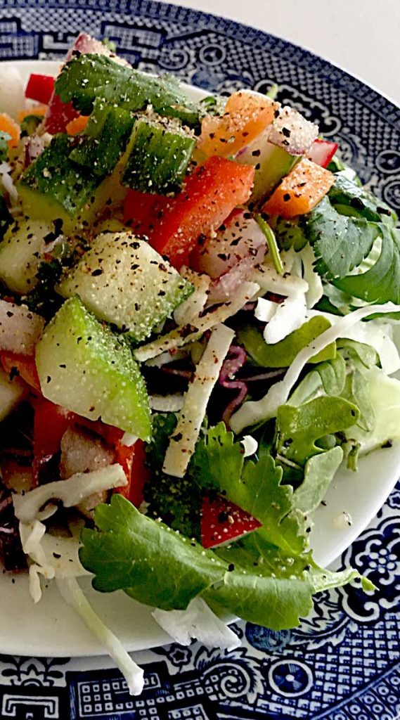 Crunchy Confetti Salad by Bari Healthy Life is a colorful and deeply nutritious plate of raw veggies and leafy greens.